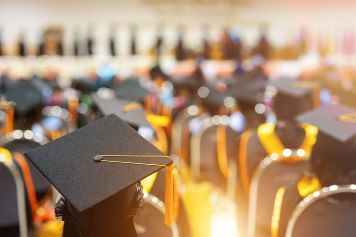 Graduating class listens to inspiring graduation quotes.